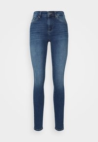 Jeans ajustados de denim azul oscuro. Presentan una cintura alta, cinco bolsillos y un cierre de botones. Textura suave y diseño de corte estrecho.