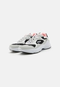 Gray and black athletic shoes with white and pink accents. Mesh and synthetic materials, round toes, and laces. Notable logo on the side.