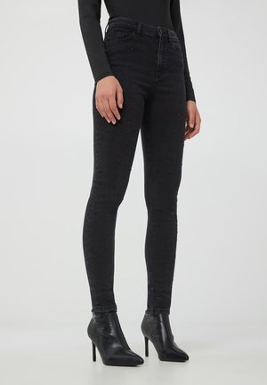 VITA ALTA CON STRASS - Jeans Skinny Fit - nero denim