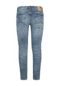 Jeans skinny din denim albastru deschis, cu un design clasic cu cinci buzunare, detalii de cusătură vizibile și o etichetă din piele la talie.