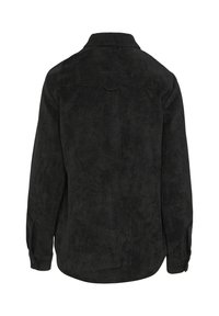 Zwarte corduroy overhemd met een kraag, lange mouwen en een knoopmanchet. Beschikt over verticale ribbels en een afgeronde zoom aan de achterkant.