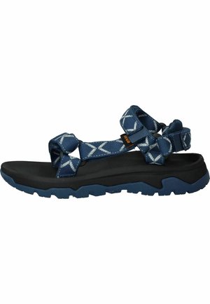 Blauwe en zwarte robuuste buitensandaal met verstelbare patroonbanden en dikke, getextureerde zool voor grip en comfort.