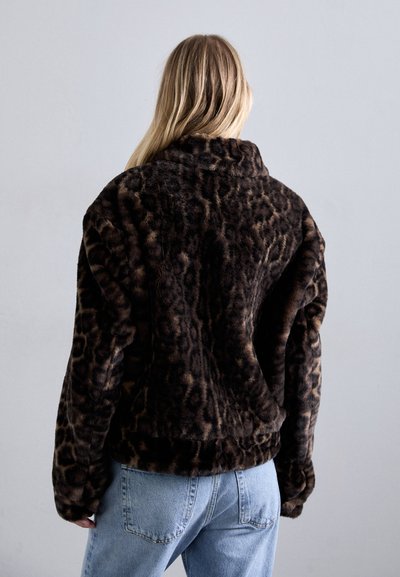 Leopard print faux fur jacket with long sleeves, a high collar, and a relaxed fit; soft texture in dark brown and tan colors.