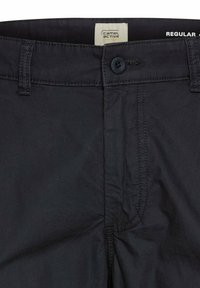 Dark navy cotton trousers with a regular fit, featuring a button closure, contrasting stitching, and label on the waistband.