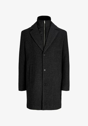 Tumesinine villasegukattega mantel mitte nurga kaelusega, kahe nupu ja kolme taskuga. Sisaldab lisaks soojustamiseks musta lukuga sisekihti.