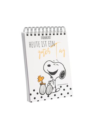 Spiral-bound notebook featuring a white cover with black polka dots, an illustration of Snoopy and Woodstock, and German text in orange and black.