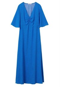 Robe bleue avec manches courtes évasées, encolure en V, détails froncés au niveau de la poitrine, et jupe fluide à motif à pois.