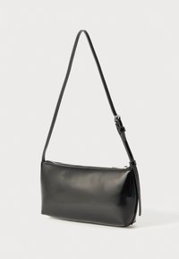 Black, glossy leather shoulder bag with a rectangular shape, a zip closure, and a slim adjustable strap. Simple design with no visible patterns.