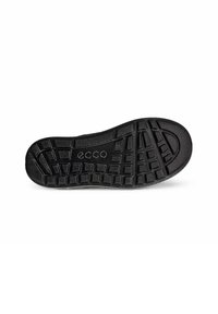 Svart gummisula med ett texturerat mönster, med strukturerade, upphöjda sektioner för grepp och stabilitet. Ecco-logotypen är närvarande.