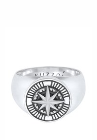 Silver ring featuring a compass design, with a textured black center and a prominent star in the middle. Smooth, polished band.