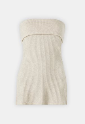 Κρέμα ριμπ τοπ με ίσια λαιμόκοψη, εφαρμοστό σχέδιο και μαλακή υφή. Χωρίς κλεισίματα ή διακοσμήσεις.