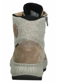 Stivale alla caviglia in lana e suede di un beige chiaro e grigio. Presenta una suola in gomma grigia, chiusura con zip e una toppa di tessuto rotonda sul retro.