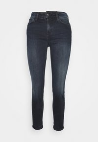 Dark blue skinny jeans with a classic five-pocket design, high waist, subtle fading, and traditional button and zipper closure.