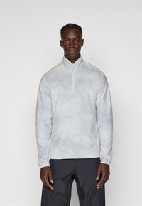 Hallhallane fliisist pullover kõrge kraega ja poole tõmblukuga. Sellel on peen, udune muster ja väike logo rinnal.