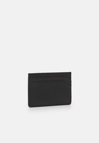 Black leather cardholder with a smooth texture, featuring multiple card slots, a minimalist design, and subtle stitching details.