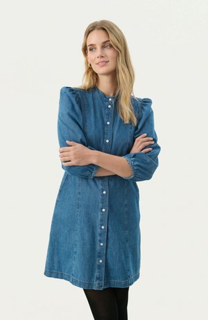 Denim dress with a button-down front, gathered sleeve detail, and a relaxed fit. Medium blue color and lightweight texture, knee length.