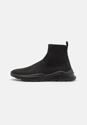 Black high-top sock sneaker with knitted fabric upper and thick textured sole, designed for lightweight comfort and ankle support.
