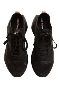 Black athletic shoes with a mesh upper, flat laces, and a subtle pink accent on the heel. Rounded toe and textured sole for grip.