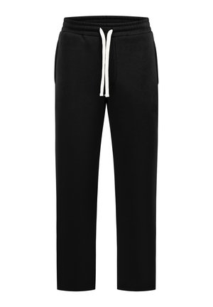 Pantalon de survêtement noir avec taille élastique et cordon blanc, doté de poches latérales et d'une coupe décontractée à jambe droite.