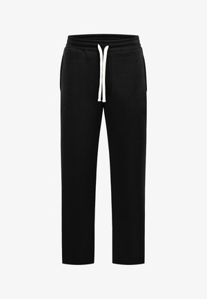 Pantalon de survêtement noir avec taille élastique et cordon blanc, doté de poches latérales et d'une coupe décontractée à jambe droite.