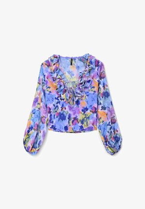 Blouse légère à imprimé floral avec un col à volants et des manches longues bouffantes. Présente des nuances de violet, jaune et bleu sur un tissu transparent.