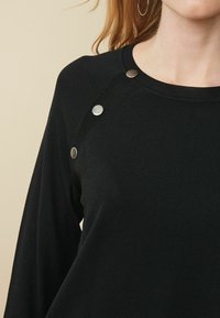 Next Sweter