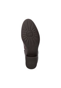 Suela de goma marrón con patrón texturizado, que incluye un diseño circular central y características de agarre. Marca "Anti Slide" en la parte inferior.