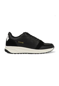 Black athletic sneakers with a mix of smooth leather and textured suede, featuring a white sole, branding on the side, and yellow stitching accents.