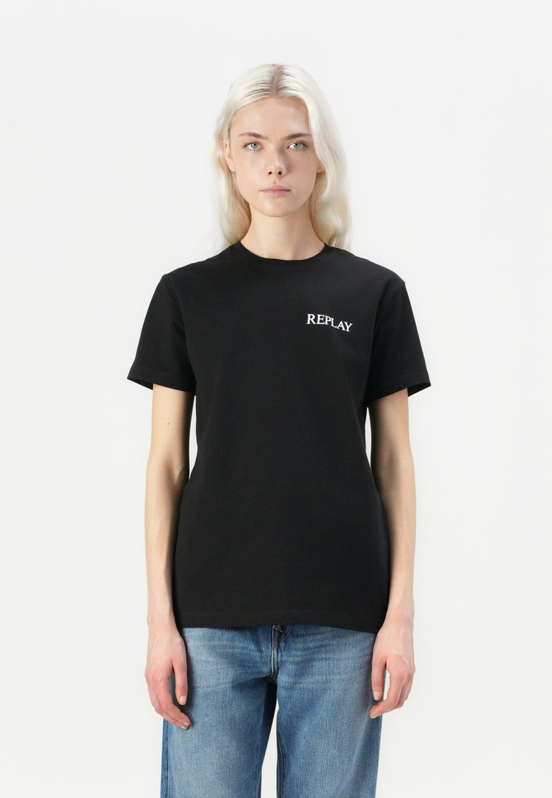 Black cotton t-shirt with short sleeves, featuring the word "REPLAY" in white print on the left chest. Casual, straight fit.