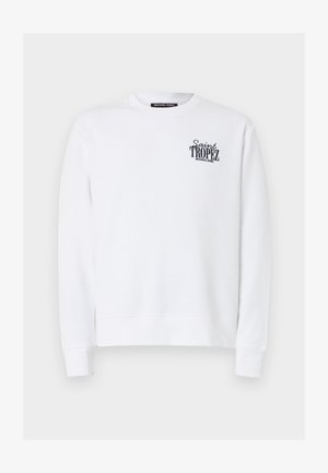 Balta krekla ar garo garām piedurknēm un apaļu apkakli, ar melnu uzrakstu “Saint Tropez Michael Kors” uz kreisā krūtīm.