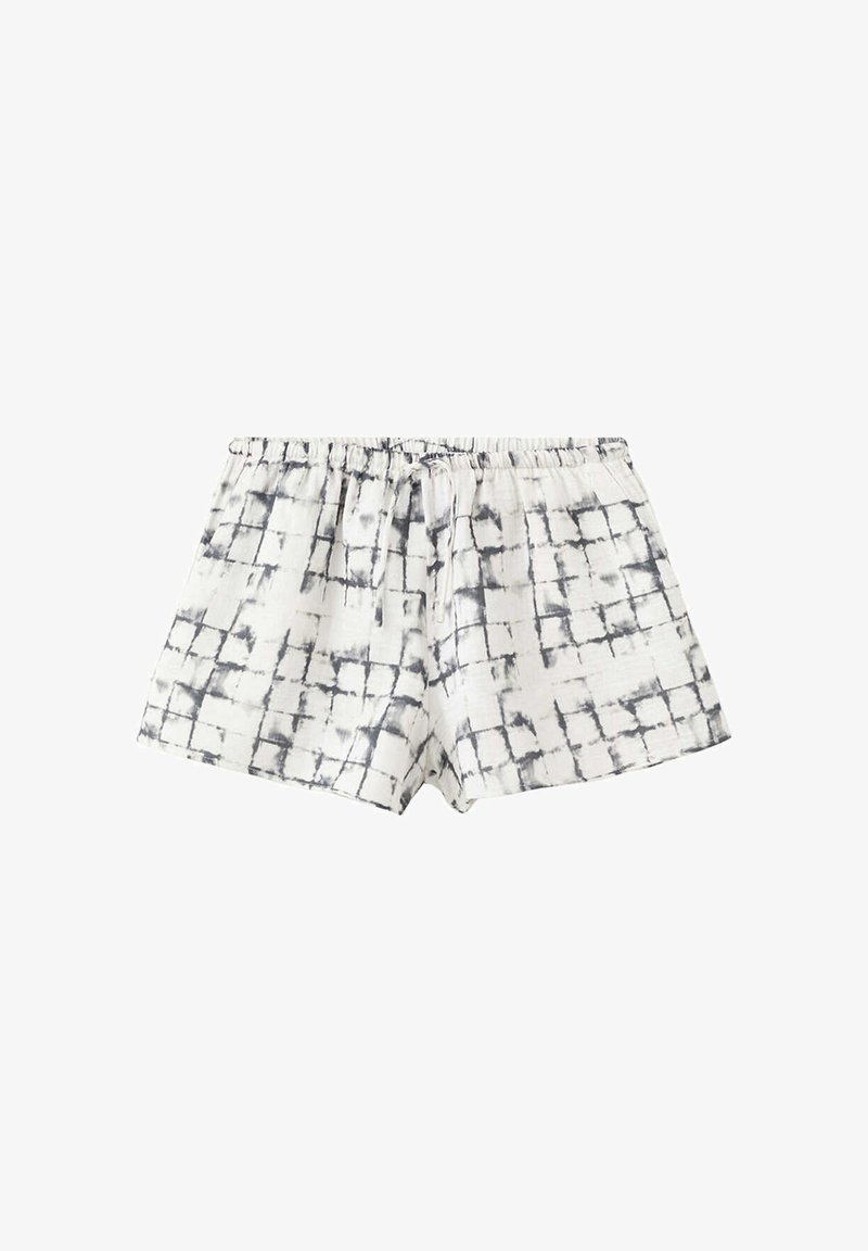 Shorts en coton blanc avec motif à grille noire et taille élastique avec cordon, posés à plat sur un fond blanc.