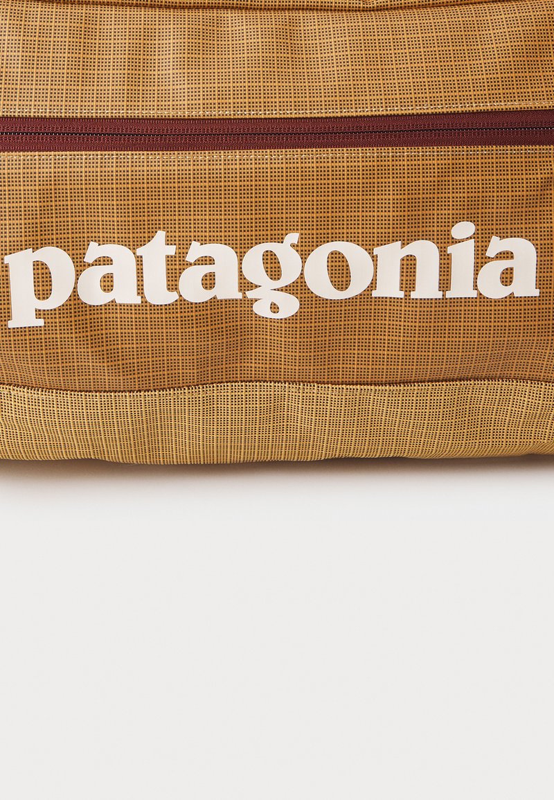Patagonia BLACK HOLE DUFFEL - Sports bag - talon gold-coloured/blue -  Zalando
