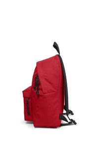 Red backpack with black accents, featuring a main compartment, side pocket, adjustable straps, and drawstring closures. Smooth fabric texture.