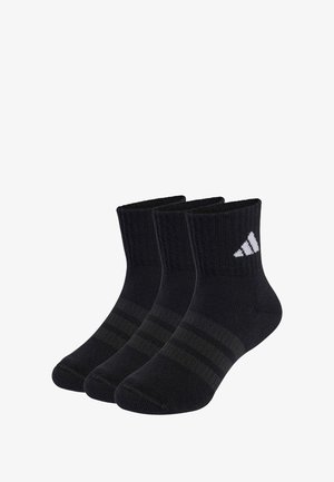 Black athletic socks with a ribbed texture, ankle length, featuring two dark green horizontal stripes and a white Adidas logo. Three pairs included.
