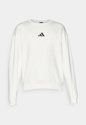 White sweatshirt made of cotton, featuring a round neckline, wide cuffs, and a small black Adidas logo on the chest.