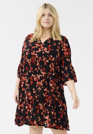 Black floral dress with red and pink flowers, V-neck, flared 3/4 sleeves, and tiered design that flows loosely from the waist. Soft fabric.
