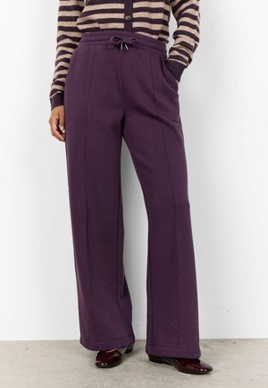 Paarse wijde sweatpants met elastische tailleband en trekkoord. Gemaakt van een zachte stof, met een gladde textuur en rechte snit.