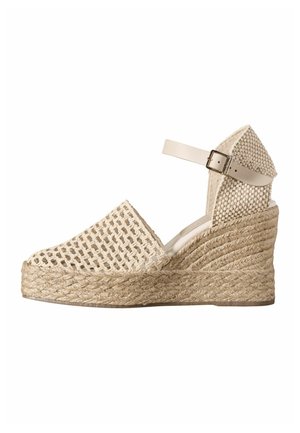 Beige wedge sandal with woven jute platform, open weave front, closed back, and adjustable ankle strap with metal buckle.