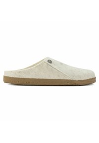 Wool slip-on slippers in light cream with a textured surface and a brown rubber sole; features a decorative metal logo accent.