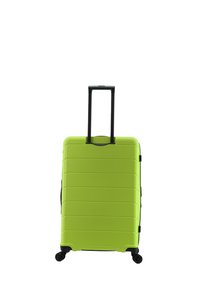 Green hardshell suitcase with horizontal grooves, black retractable handle, and four wheels for maneuverability. Smooth texture.