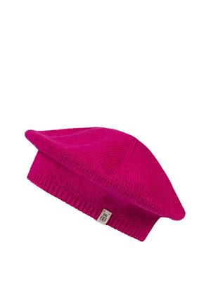 Bright pink knitted beret hat with ribbed edge and small fabric tag on white background.