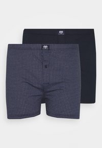 Set van katoenen boxershorts met één effen marineblauwe exemplaar en één met een marineblauwe houndstooth patroon. Beide hebben een elastische tailleband en een knoopsluiting.