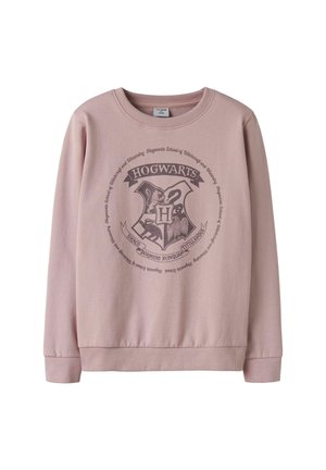 Sweatshirt rose clair avec un motif central du blason de Poudlard, col rond et poignets et ourlet côtelés. Texture de tissu douce.