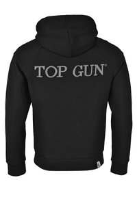 Svart huvtröja med huva och långa ärmar. "TOP GUN" är tryckt i silver på baksidan. Materialet verkar mjukt, med ribbade ärmslut och nederkant.