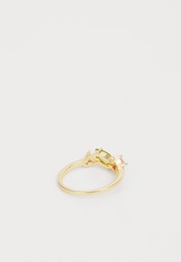 Gold ring featuring three rectangular gemstones: one green and two pink, with a polished, smooth surface and sleek design.