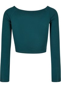 Tealfärgad ribbad långärmad crop top med vid halsringning. Tillverkad av ett stretchigt material, med åtsittande ärmar och textil med struktur.