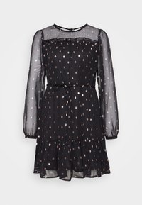 Schwarzes Kleid mit langen transparenten Ärmeln, einem gerafften Ausschnitt und einem gestuften Rock. Mit glänzenden goldenen Punkten übersät.