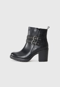 Black ankle boots made from smooth and embossed leather, featuring dual buckle straps, a chunky heel, and a textured side panel.