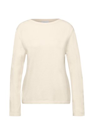 Krémový dlouhý svetr s dlouhým rukávem vyrobený z měkké pleteniny, s kulatým výstřihem a žebrovanými manžetami na rukávech a spodním lemu.