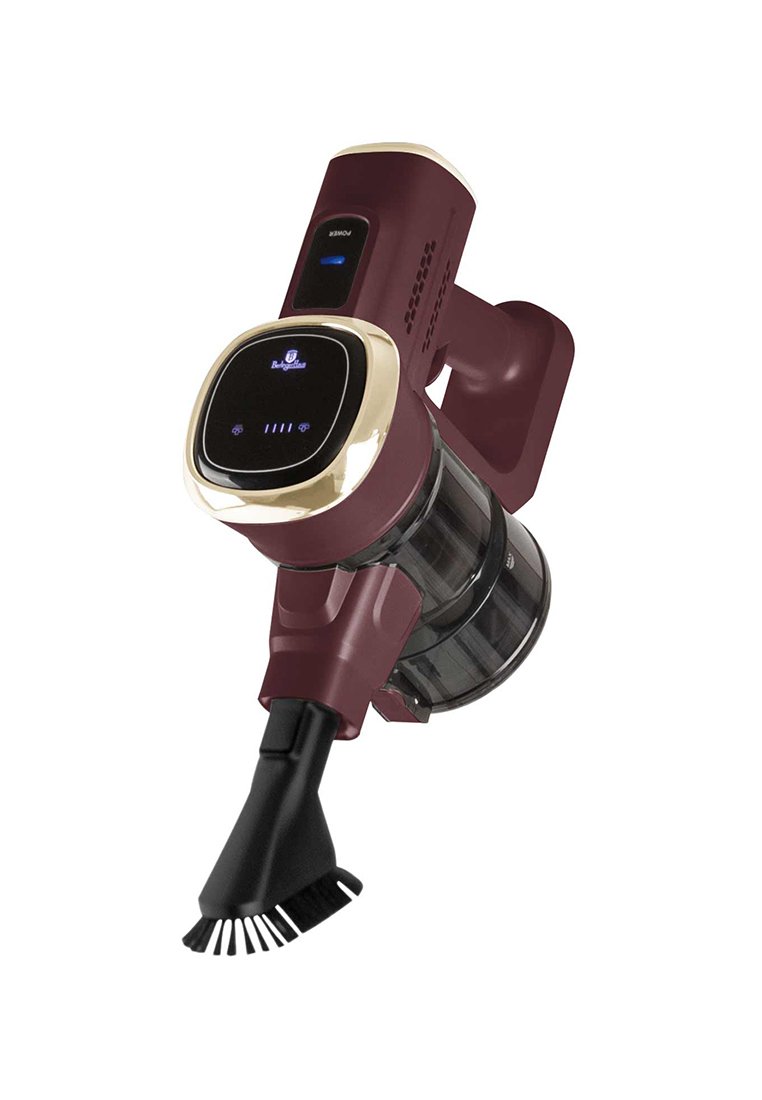 Bezdrátový vysavač v barvě burgundské červené se zlatými akcenty, průhlednou nádobou na prach a odnímatelnou hlavicí kartáče. Disponuje digitálním ovládacím panelem.